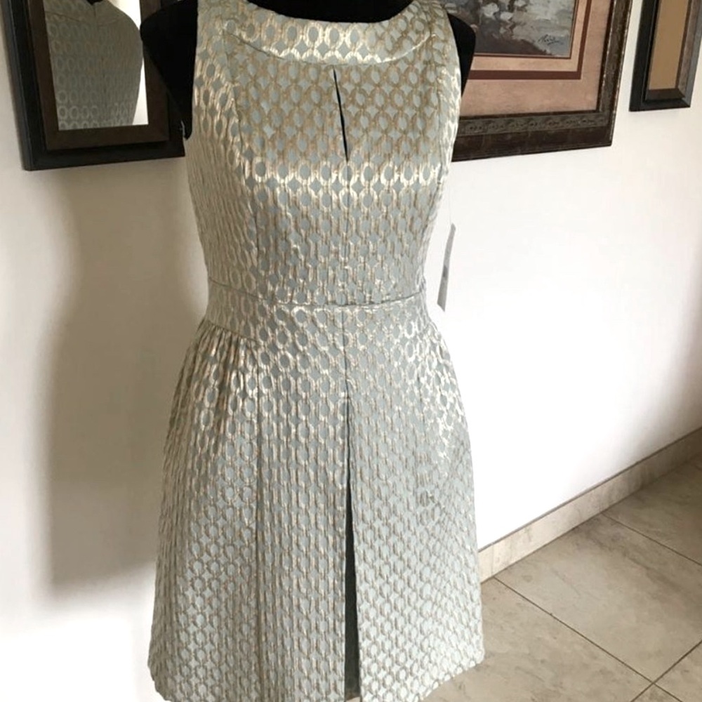 Beautiful size 6 Ralph Lauren dress. Gold and baby blue.